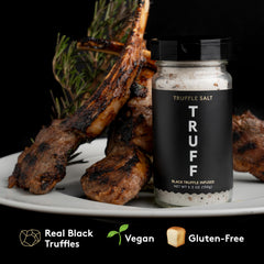 Sprinkling TRUFF salt on steak for aroma and depth