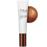 TULA Bronze Boost Glow bottle on vanity for radiant skin