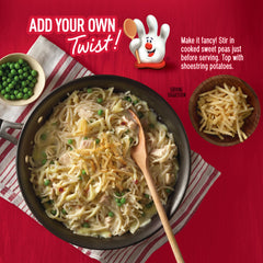 Tuna Helper Tetrazzini plated with peas and shoestring potatoes, family-friendly serving.