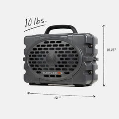 Turtlebox Original Gen 3 on beach scene showing durable outdoor speaker for sun and sand