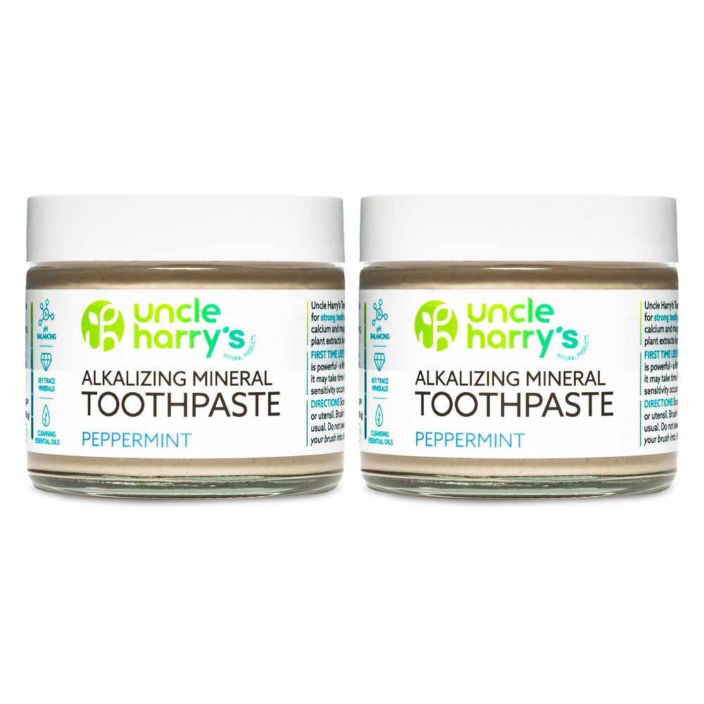 Uncle Harry's Peppermint Remineralizing Toothpaste in a glass jar for eco-friendly brushing.
