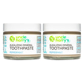 Uncle Harry's Peppermint Remineralizing Toothpaste in a glass jar for eco-friendly brushing.