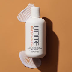 UNITE BoING Defining Curl Cream application scene enhances curl definition and moisture.