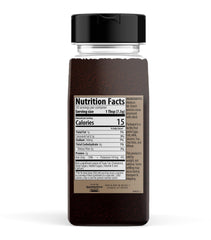Unpretentious Black Cocoa Powder sifted into bowl for rich baking.