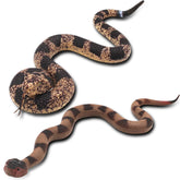 Upitry rubber snakes on a branch deter birds with lifelike realism