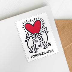 USPS Love 2025 stamp with red heart and radiating lines for greeting cards.