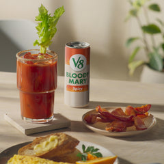 Brunch table setup with V8 Bloody Mary Spicy Mix and garnishes