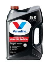 Valvoline High Mileage 150K bottle pouring oil to engine for smoother operation.