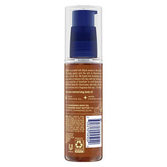 Close-up texture of Vaseline Illuminate Me Shimmering Body Oil highlighting moisture