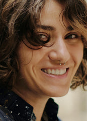 VELCARE rainbow fake nose ring closeup demonstrates colorful fashion accessory.