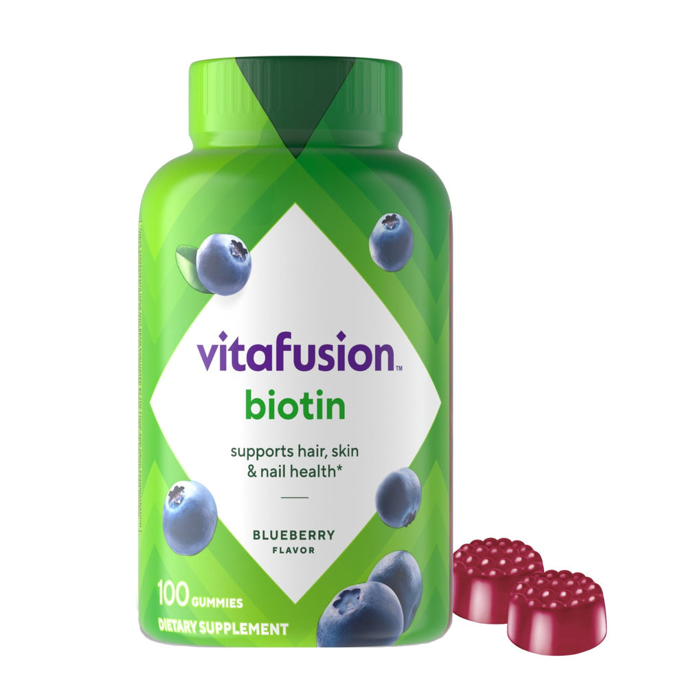 Vitafusion Biotin gummies in blue bottle, blueberry flavor, supporting hair and nails.