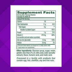 Vitafusion Power Zinc gummies closeup with strawberry-tangerine flavor.