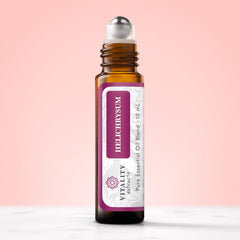 Vitality Helichrysum Roll-On applied at temples and wrists for quick use.