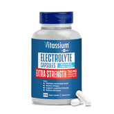 Vitassium electrolyte capsules bottle pour showing portable daily electrolyte support.