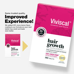 Viviscal tablets close-up showing coating and brand label for quality.
