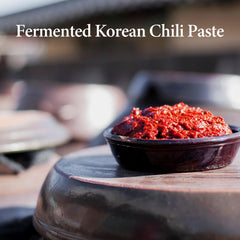 Wang Gochujang jar close-up emphasizes deep fermentation and rich color.