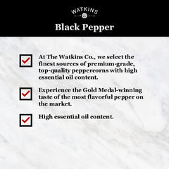 Close-up of pepper grains in the Watkins tin for vibrant, consistent seasoning.