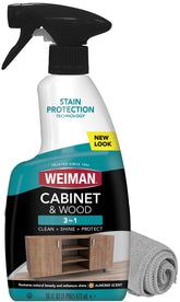 Weiman Cabinet & Wood Clean & Shine bottle applying to cabinets for renewed shine