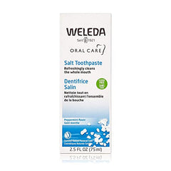 Weleda Natural Salt Toothpaste tubes beside sea salt crystals on packaging for mineral-inspired care.