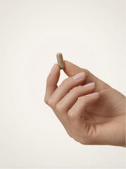 WELLBEL Women+ 90-count bottle on desk suggesting ongoing daily routine