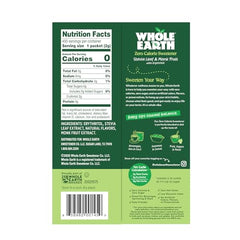 Whole Earth packets beside coffee cup for zero-calorie sweetness