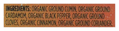 Close-up of Whole Foods Market garam masala label showing organic and non-GMO verification.