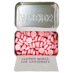 Wrigley's Altoids Cinnamon mints close-up highlighting spicy-sweet aroma and freshness