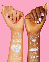 xo Fetti Cheers Bachelorette tattoos with the Cheers script and sparkles for playful party vibes.
