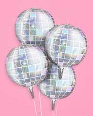 xo, Fetti groovy birthday party decor with disco ball balloons.