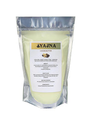 Yajna Organic Raw Cocoa Butter jar close-up showing smooth ivory texture for skin hydration.