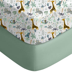 Yoofoss pack and play sheet in green giraff pattern on a playpen mattress for breathable comfort.