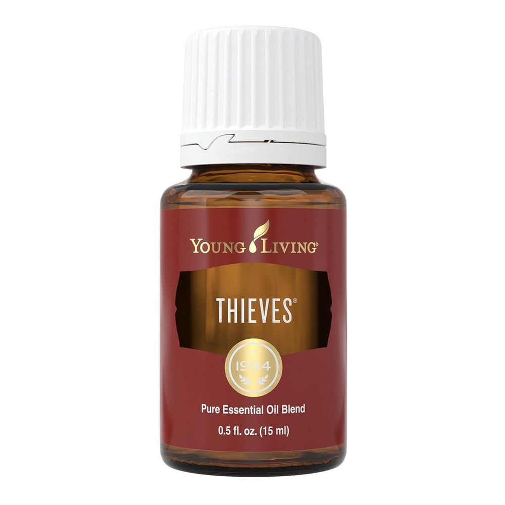 Young Living Thieves essential oil bottle close-up for a spicy, uplifting aroma.