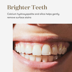 Brushing with Young Living Thieves Whitening Toothpaste for a refreshing mint experience.