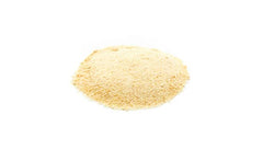 Yupik date powder being measured; convenient for adding to beverages and batters.