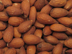 Yupik dry roasted almonds close-up of golden toasted nuts.