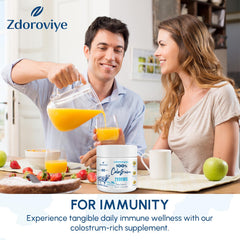 Zdoroviye liposomal bovine colostrum powder being poured into a glass