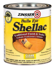 Zinsser Bulls Eye Clear Shellac 1 Qt bottle pouring, fast-drying odor-blocking wood finish.