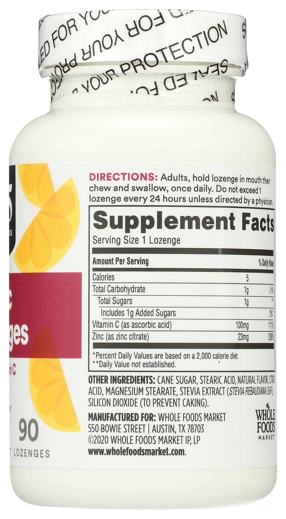 Lemon slice beside lozenges for flavor cue
