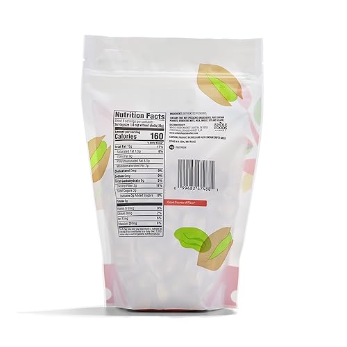 Pistachios pouring into a bowl for a quick, protein-rich snack.