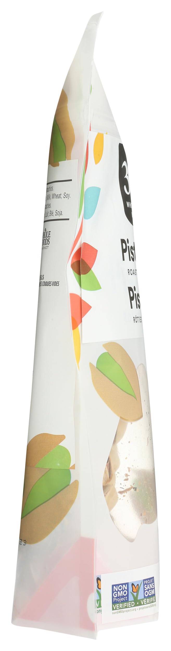 Roasted pistachios surface with golden color suggesting rich flavor.
