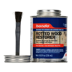 3M Bondo Rotted Wood Restorer applying to rotted wood fibers to halt decay.