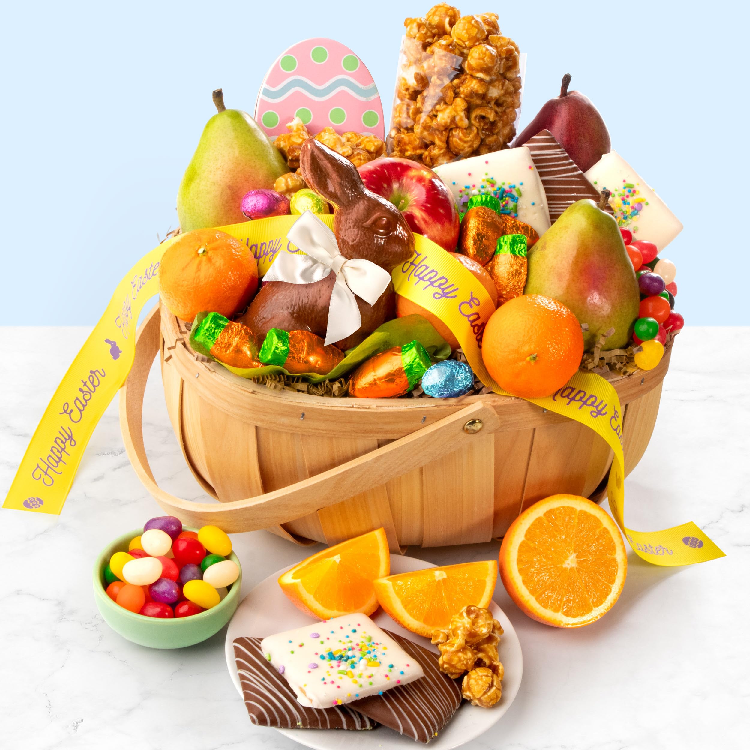 A Gift Inside Easter Bunny Fruit and Treats Basket full display with chocolates and fruit, perfect for sharing.