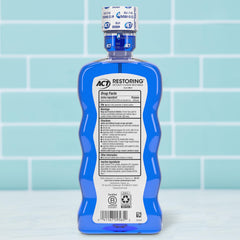 ACT Restoring Fluoride Mouthwash 18 oz bottle front view highlighting enamel protection