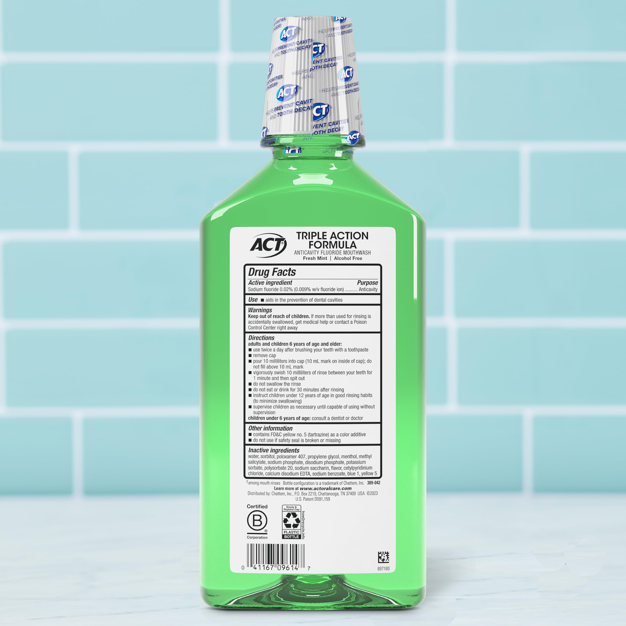 Close-up of ACT Total Care Zero Alcohol Mouthwash Fresh Mint label with fluoride and no alcohol.