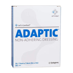 Adaptic non-adherent dressing 3x3 close-up shows petrolatum barrier for gentle removal.