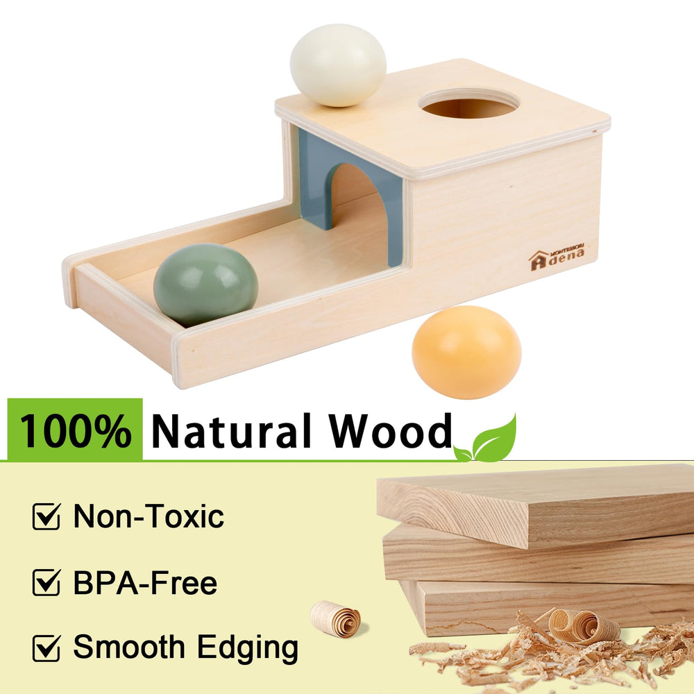 Adena Montessori toddler engages with object permanence box to encourage focus.