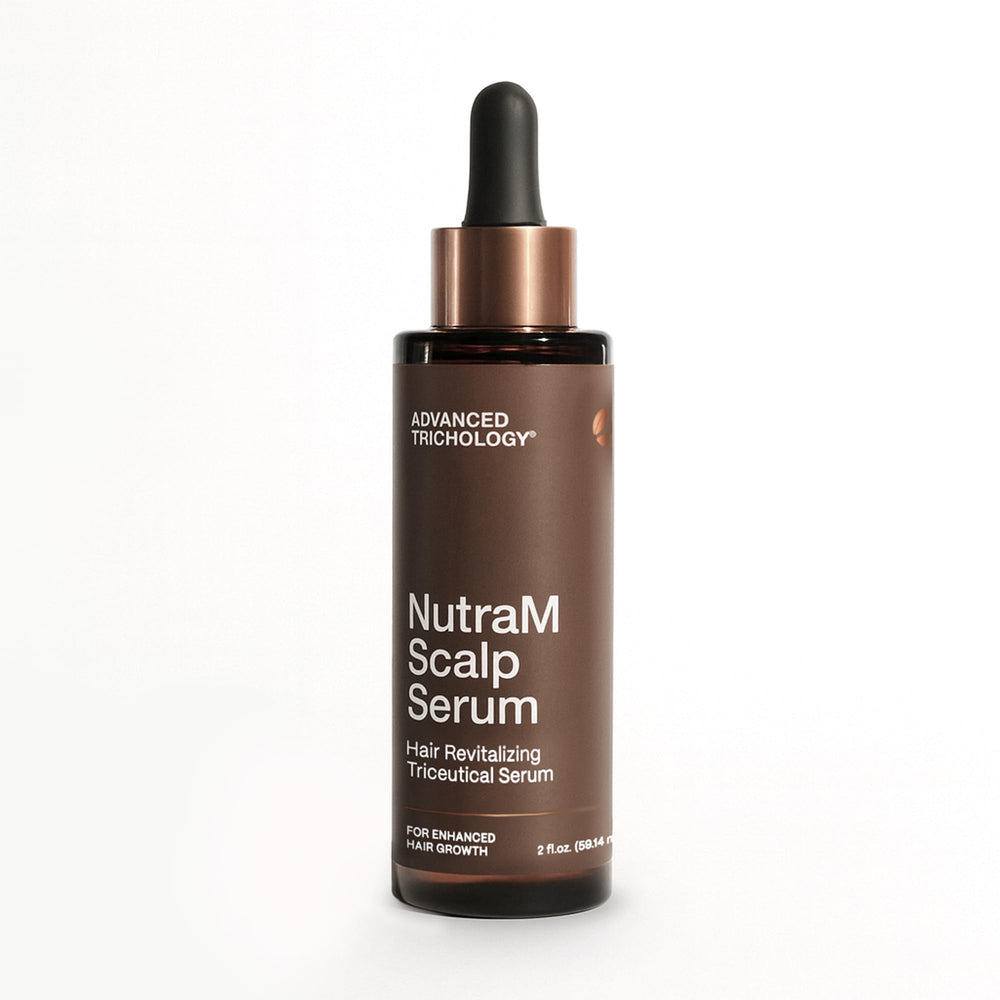 Advanced Trichology NutraM bottle being poured for controlled scalp application.