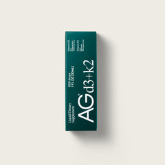 AG1 D3+K2 drops dropper in use for precise, customizable dosing.