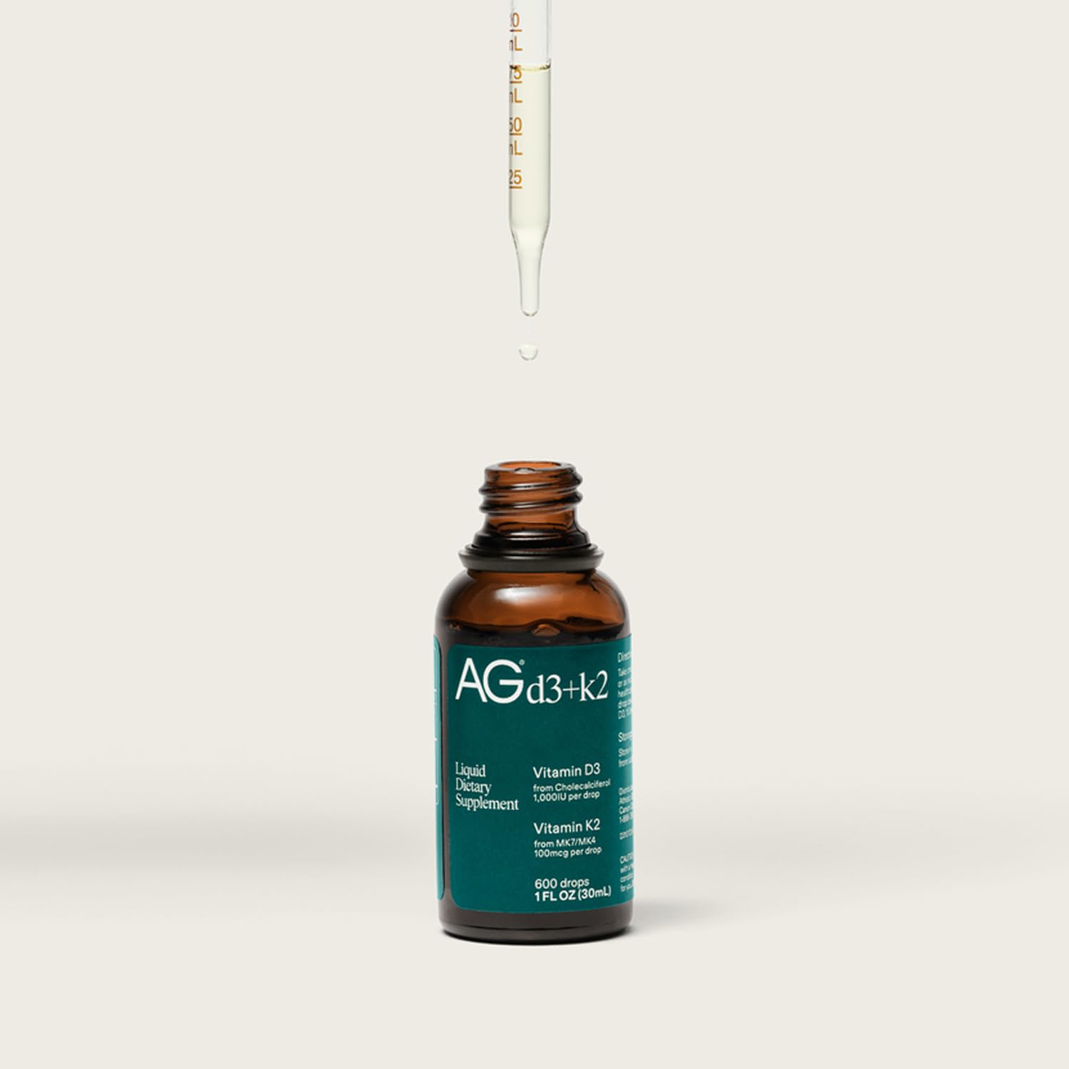 AG1 D3+K2 drops bottle highlights potential immune support.
