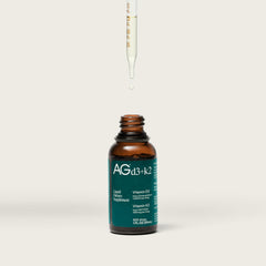 AG1 D3+K2 drops bottle highlights potential immune support.